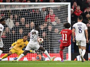 Liverpool's Egyptian striker #11 Mohamed Salah (2R) scores the team's fifth goal during the UEFA Europa League group E football match between Liverpool and Toulouse at Anfield in Liverpool, north west England on October 26, 2023. Liverpool won the match 5-1. (Photo by Oli SCARFF / AFP)
