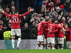 Manchester United's English defender #05 Harry Maguire (unseen) celebrates with teammates after scoring his team first goal during the UEFA Champions League Group A football match between Manchester United and FC Copenhagen at Old Trafford, in Manchester, north-west England, on October 24, 2023. (Photo by Paul ELLIS / AFP)