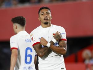 Barcelona's Brazilian forward #11 Raphinha celebrates after scoring his team's first goal during the Spanish Liga football match between RCD Mallorca and FC Barcelona at the Mallorca Son Moix stadium in Palma de Mallorca on September 26, 2023. (Photo by JAIME REINA / AFP)