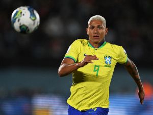 Brazil's forward Richarlison runs to the ball during the 2026 FIFA World Cup South American qualification football match between Uruguay and Brazil at the Centenario Stadium in Montevideo on October 17, 2023. (Photo by Eitan ABRAMOVICH / AFP)
