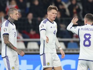 Scotland's midfielder #04 Scott McTominay celebrates with teammates after scoring the team's first goal during the UEFA Euro 2024 football tournament Group A qualifying match between Georgia and Scotland in Tbilisi on November 16, 2023. (Photo by Giorgi ARJEVANIDZE / AFP)