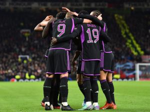 Bayern Munich's players celebrate the opening goal scored by Bayern Munich's French forward #11 Kingsley Coman during the UEFA Champions League group A football match between Manchester United and FC Bayern Munich at Old Trafford stadium in Manchester, north west England, on December 12, 2023. (Photo by PETER POWELL / AFP)