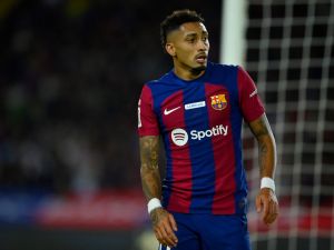 Barcelona's Brazilian forward #11 Raphinha reacts during the Spanish league football match between FC Barcelona and Girona FC at the Estadi Olimpic Lluis Companys in Barcelona on December 10, 2023. (Photo by Pau BARRENA / AFP)