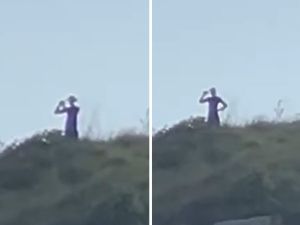 Tall alien-like creatures filmed roaming on hillside in Brazil. (X)