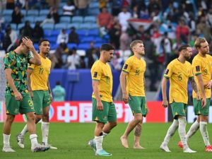 Australia's players leave the pitch after the Qatar 2023 AFC Asian Cup Group B football match between Australia and Uzbekistan at the Al-Janoub Stadium in Al-Wakrah, south of Doha on January 23, 2024. (Photo by HECTOR RETAMAL / AFP)