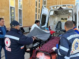 Egyptian paramedics transport an injured Palestinian child to a Red Crescent ambulance upon his arrival from Gaza via the Rafah border crossing, on January 10, 2024 amid the ongoing conflict between Israel and the militant group Hamas. (Photo by AFP)