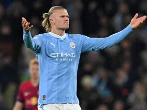 Manchester City's Norwegian striker #09 Erling Haaland rallies the crowd after scoring the team's first goal during the UEFA Champions League Group G football match between Manchester City and RG Leipzig at the Etihad Stadium, in Manchester, north west England, on November 28, 2023. (Photo by Paul ELLIS / AFP)