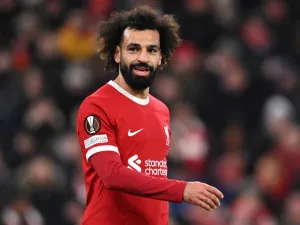 Liverpool's Egyptian striker #11 Mohamed Salah smiles during the UEFA Europa League group E football match between Liverpool and Linzer ASK at Anfield in Liverpool, north west England on November 30, 2023. (Photo by Oli SCARFF / AFP)