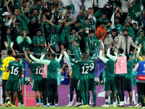 Saudi Arabia's players celebrate with their supporters after the Qatar 2023 AFC Asian Cup Group F football match between Kyrgyzstan and Saudi Arabia at the Ahmad Bin Ali Stadium in Al-Rayyan, west of Doha on January 21, 2024. (Photo by KARIM JAAFAR / AFP)