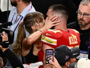 Best Taylor Swift Super Bowl moments: Swift Jumps of joy wearing Travis Kelce 87 necklace as Kansas City Chiefs win. (Patrick T. Fallon/ AFP)