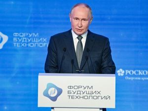 In this pool photograph distributed by Russian state agency Sputnik, Russia's President Vladimir Putin addresses the audience during the Future Technologies Forum at the World Trade Center in Moscow on February 14, 2024. (Photo by Alexey MAISHEV / POOL / AFP) Putin