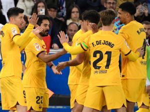 Barcelona players celebrate their second goal scored by Barcelona's German midfielder #22 Ilkay Gundogan (2L) during the Spanish league football match between Deportivo Alaves and FC Barcelona at the Mendizorroza stadium in Vitoria on February 3, 2024. (Photo by Ander Gillenea / AFP)