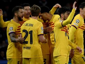 Napoli's Nigerian forward #09 Victor Osimhen (2nd L) celebrates with team mates after scoring a goal during the UEFA Champions League round of 16 first Leg football match between Napoli and Barcelona at the Diego-Armando-Maradona stadium in Naples on February 21, 2024. (Photo by Filippo MONTEFORTE / AFP)