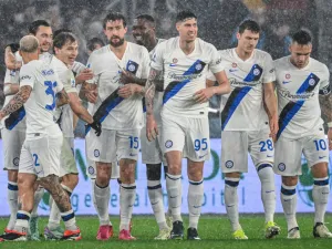 Inter Milan's Italian defender #15 Francesco Acerbi (C-L) celebrates with teammates after opening the scoring during the Italian Serie A football match between AS Roma and Inter Milan at the Olympic stadium in Rome on February 10, 2024. (Photo by Alberto PIZZOLI / AFP)
