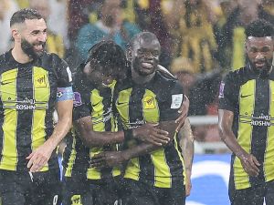 Ittihad's French forward #09 Karim Benzema (L) and Ittihad's French midfielder #07 N'Golo Kante (C) celebrate after a goal during the FIFA Club World Cup first round football match between Al-Ittihad and Auckland City at the King Abdullah Sports City stadium in Jeddah, on December 12, 2023. Al Ittihad secured progress from the first round of the Club World Cup with a convincing 3-0 win against Auckland City. (Photo by AFP)
