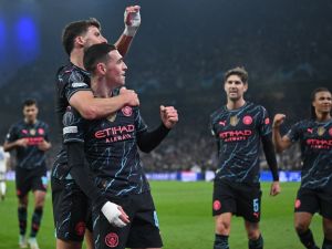 Manchester City's English midfielder #47 Phil Foden celebrates with Manchester City's Portuguese defender #03 Ruben Dias scoring during the UEFA Champions League round of 16, first-leg football match between FC Copenhagen and Manchester City in Copenhagen, Denmark, on February 13, 2024. (Photo by Jonathan NACKSTRAND / AFP)