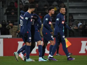 Paris Saint-Germain's French midfielder #13 Senny Mayulu (L) celebrates with his teammate after scoring his team's fourth goal during the French Cup round of 32 football match between US Orleans Loiret Football and Paris Saint-Germain (PSG) at the Stade de la Source, in Orleans, central France, on January 20, 2024. (Photo by Guillaume SOUVANT / AFP)