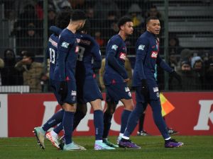 Paris Saint-Germain's French midfielder #13 Senny Mayulu (L) celebrates with his teammate after scoring his team's fourth goal during the French Cup round of 32 football match between US Orleans Loiret Football and Paris Saint-Germain (PSG) at the Stade de la Source, in Orleans, central France, on January 20, 2024. (Photo by Guillaume SOUVANT / AFP)
