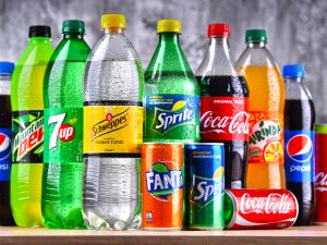 Bottles of global soft drink brands including products of Coca Cola