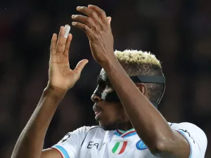Napoli's Nigerian forward #09 Victor Osimhen claps during the UEFA Champions League last 16 second leg football match between FC Barcelona and SSC Napoli at the Estadi Olimpic Lluis Companys in Barcelona on March 12, 2024. (Photo by LLUIS GENE / AFP)