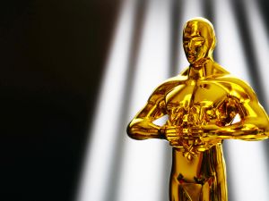 Hollywood celebrities show their support for Palestine at Oscars 2024, wear red pins and call for a ceasefire Amid Protests. (Shutterstock)