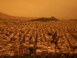 Clouds of dust blown in from the Sahara covered Athens and other Greek cities on April 23, 2024, one of the worst such episodes to hit the country since 2018, officials said. The yellow-orange haze smothered several regions, limiting visibility and prompting warnings of breathing risks from the authorities. (Photo by Angelos TZORTZINIS / AFP) Greek sky