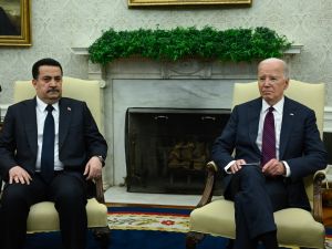 US President Joe Biden (R) meets with the Prime Minister of Iraq Mohammed Shia al-Sudani in the Oval Office of the White House in Washington, DC on April 15, 2024.