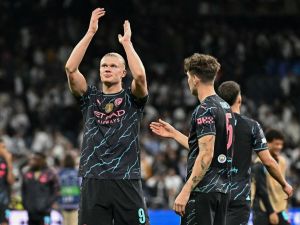 Manchester City's Norwegian striker #09 Erling Haaland applauds at the end of the UEFA Champions League quarter final first leg football match between Real Madrid CF and Manchester City at the Santiago Bernabeu stadium in Madrid on April 9, 2024. The match ended in a 3-3 draw. (Photo by JAVIER SORIANO / AFP)