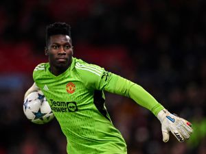 Manchester United's Cameroonian goalkeeper #24 Andre Onana throws the ball during the UEFA Champions League Group A football match between Manchester United and FC Copenhagen at Old Trafford, in Manchester, north-west England, on October 24, 2023. (Photo by Paul ELLIS / AFP)
