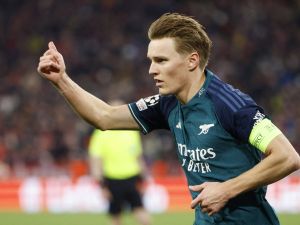 Arsenal's Norwegian midfielder #08 Martin Odegaard reacts during the UEFA Champions League quarter-final second leg football match between FC Bayern Munich and Arsenal FC in Munich, southern Germany on April 17, 2024. (Photo by Michaela STACHE / AFP)