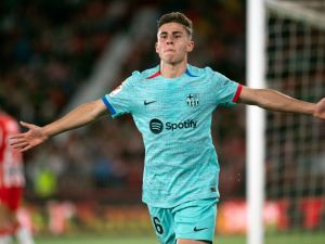 Barcelona's Spanish midfielder #16 Fermin Lopez celebrates scoring the opening goal during the Spanish league football match between UD Almeria and FC Barcelona at the Municipal Stadium of the Mediterranean Games in Almeria on May 16, 2024. (Photo by JORGE GUERRERO / AFP)