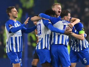 Brighton players celebrate on the final whistle in the UEFA Europa League Group B football match between Brighton and Hove Albion and Marseille at the American Express Community Stadium in Brighton, southern England on December 14, 2023. Brighton won the game 1-0 and top the Group. (Photo by Glyn KIRK / AFP)