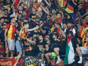 Esperance supporters sing during the CAF Champions League second-leg semifinal football match between South Africa’s Mamelodi Sundowns and Tunisia's Esperance Sportive de Tunis at Loftus Versfeld Stadium in Pretoria on April 26, 2024. (Photo by Phill Magakoe / AFP)