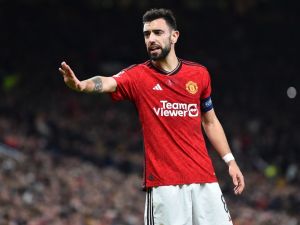 Manchester United's Portuguese midfielder #08 Bruno Fernandes gestures during the UEFA Champions League group A football match between Manchester United and FC Bayern Munich at Old Trafford stadium in Manchester, north west England, on December 12, 2023. (Photo by PETER POWELL / AFP)