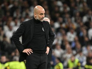 Manchester City's Spanish manager Pep Guardiola watches his players from the touchline during the UEFA Champions League quarter final first leg football match between Real Madrid CF and Manchester City at the Santiago Bernabeu stadium in Madrid on April 9, 2024. (Photo by JAVIER SORIANO / AFP)