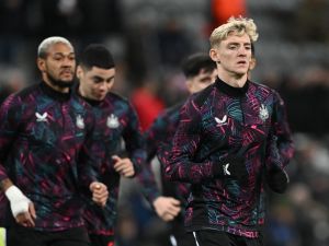 Newcastle United's English midfielder #10 Anthony Gordon warms up prior to the UEFA Champions League Group F football match between Newcastle United and AC Milan at St James' Park in Newcastle-upon-Tyne, north east England on December 13, 2023. (Photo by Paul ELLIS / AFP)