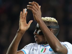 Napoli's Nigerian forward #09 Victor Osimhen claps during the UEFA Champions League last 16 second leg football match between FC Barcelona and SSC Napoli at the Estadi Olimpic Lluis Companys in Barcelona on March 12, 2024. (Photo by LLUIS GENE / AFP)