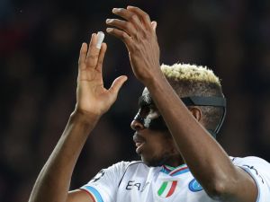 Napoli's Nigerian forward #09 Victor Osimhen claps during the UEFA Champions League last 16 second leg football match between FC Barcelona and SSC Napoli at the Estadi Olimpic Lluis Companys in Barcelona on March 12, 2024. (Photo by LLUIS GENE / AFP)