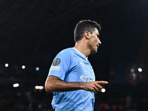 Manchester City's Spanish midfielder #16 Rodri celebrates scoring his team third goal during the UEFA Champions League Group G football match between Manchester City and FC Crvena Zvezda (Red Star Belgrade) at the Etihad Stadium in Manchester, north west England, on September 19, 2023. (Photo by Oli SCARFF / AFP)