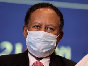 Sudan's Prime Minister Abdalla Hamdok looks on during a deal-signing ceremony with top general Abdel Fattah al-Burhan (unseen) to restore the transition to civilian rule in the country in the capital Khartoum, on November 21, 2021.