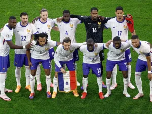 France's players pose for a team picture during the UEFA Euro 2024 Group D football match between Austria and France at the Duesseldorf Arena in Duesseldorf on June 17, 2024. (Photo by KENZO TRIBOUILLARD / AFP)