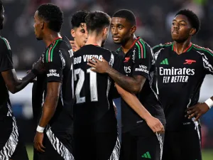Fabio Vieira #21 of Arsenal FC is congratulated by teammates after scoring a goal against AFC Bournemouth during the first half at Dignity Health Sports Park on July 24, 2024 in Carson, California. Orlando Ramirez/Getty Images/AFP (Photo by Orlando Ramirez / GETTY IMAGES NORTH AMERICA / Getty Images via AFP)