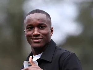 Fance's forward Moussa Diaby gestures as he arrives to take part in the French team's preparation for upcoming friendly football matches in Clairefontaine-en-Yvelines on March 18, 2024. (Photo by FRANCK FIFE / AFP)
