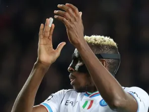 Napoli's Nigerian forward #09 Victor Osimhen claps during the UEFA Champions League last 16 second leg football match between FC Barcelona and SSC Napoli at the Estadi Olimpic Lluis Companys in Barcelona on March 12, 2024. (Photo by LLUIS GENE / AFP)