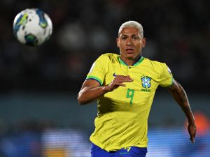 Brazil's forward Richarlison runs to the ball during the 2026 FIFA World Cup South American qualification football match between Uruguay and Brazil at the Centenario Stadium in Montevideo on October 17, 2023. (Photo by Eitan ABRAMOVICH / AFP)