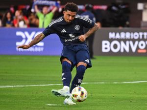 Manchester United's forward #25 Jadon Sancho scores a penalty kick during the pre-season club friendly football match between Manchester United FC and Arsenal FC at SoFi Stadium in Inglewood, California on July 27, 2024. (Photo by Patrick T. Fallon / AFP) Manchester United's forward #25 Jadon Sancho scores a penalty kick during the pre-season club friendly football match between Manchester United FC and Arsenal FC at SoFi Stadium in Inglewood, California on July 27, 2024. (Photo by Patrick T. Fallon / AFP)