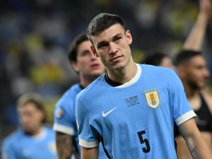 Uruguay's midfielder #05 Manuel Ugarte celebrates after scoring in a penalty shoot-out to win the Conmebol 2024 Copa America tournament quarter-final football match between Uruguay and Brazil at Allegiant Stadium in Las Vegas, Nevada on July 6, 2024. (Photo by Robyn BECK / AFP)