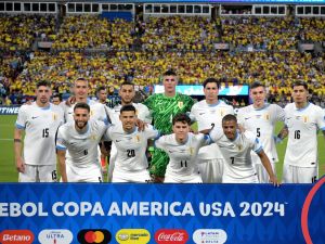 Uruguay's players pose for pictures ahead of the Conmebol 2024 Copa America tournament semi-final football match between Uruguay and Colombia at Bank of America Stadium, in Charlotte, North Caroline on July 10, 2024. (Photo by JUAN MABROMATA / AFP)