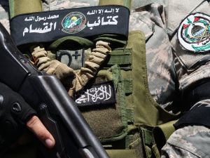 A fighter of the Ezzedine al-Qassam Brigades, attends the funeral of Samer al-Hajj, a commander of the Palestinian militant group Hamas who was killed a day earlier in an Israeli strike on a vehicle in the southern Lebanese city of Sidon, at the nearby Ain al-Helweh Palestinian refugee camp on August 10, 2024. (Photo by Mahmoud ZAYYAT / AFP)