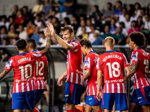 Atletico Madrid's Alexander Sorloth (3L) celebrates a goal with teammates during a friendly football match between Hong Kong’s Kitchee and Spain's Atletico Madrid at the Hong Kong stadium in Hong Kong on August 7, 2024. (Photo by Isaac LAWRENCE / AFP)